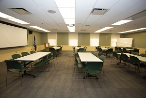 image of rotary room showing tables angled in chevron pattern, seating at each table