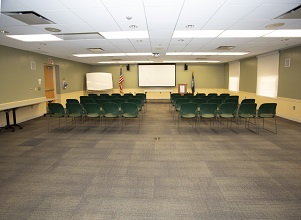 image of rotary room showing two sections of seating separated by a central aisle