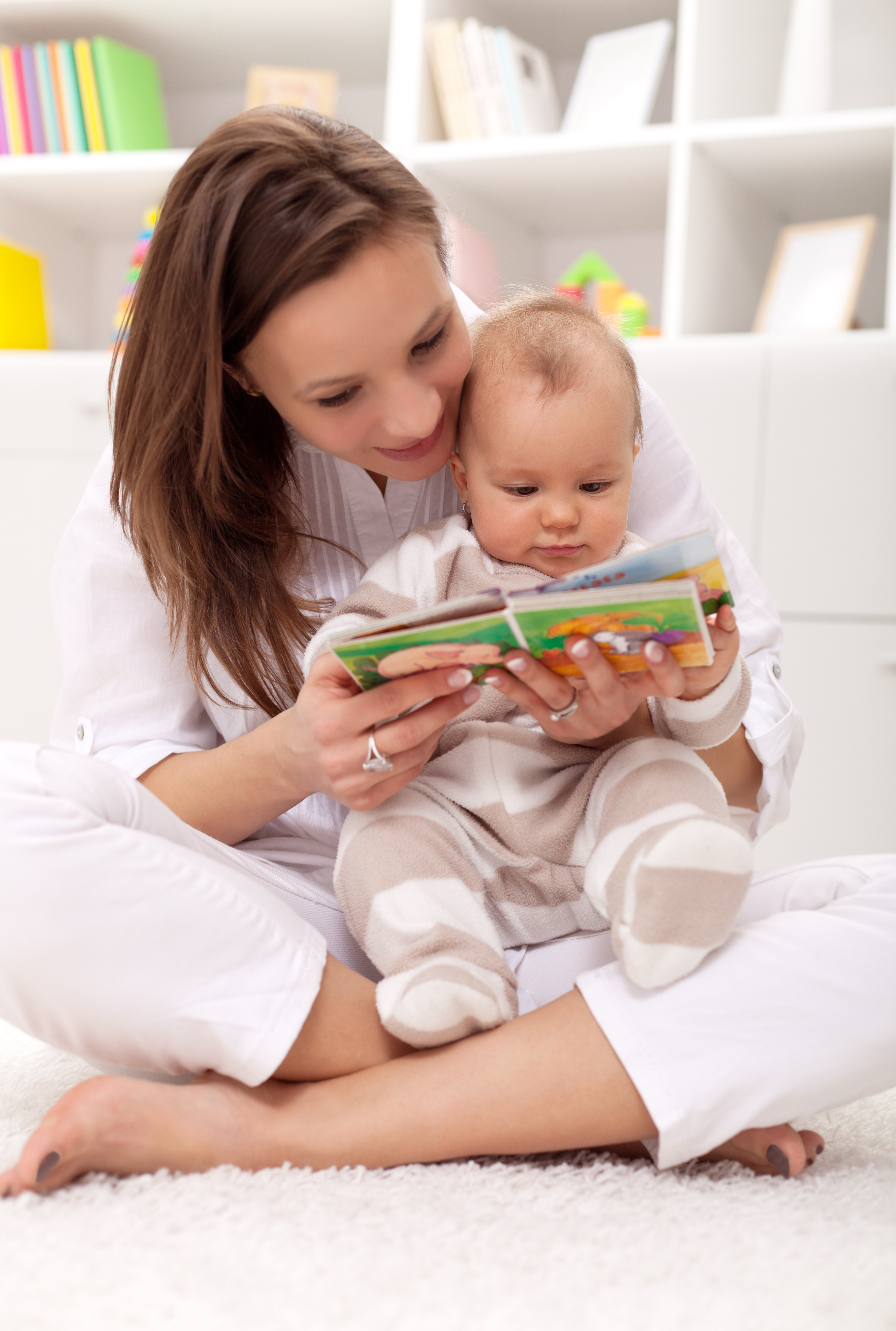 Adult reading to baby