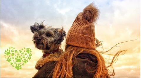 girl holding dog