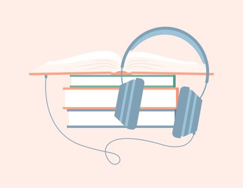 Pile of books with headphones