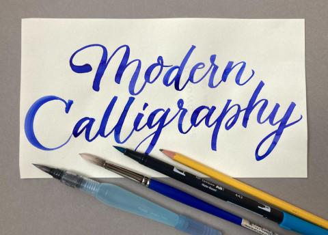modern calligraphy in blue text