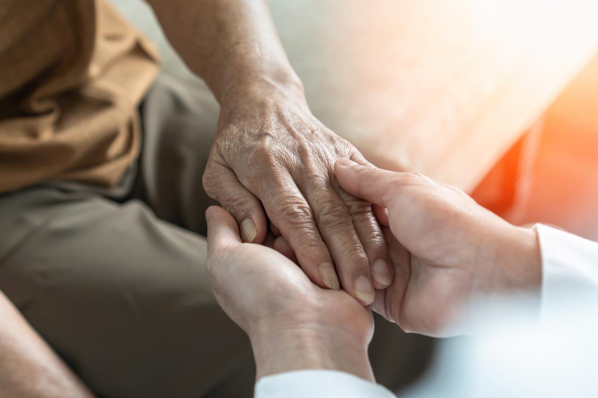 Palative care hand holding of patient