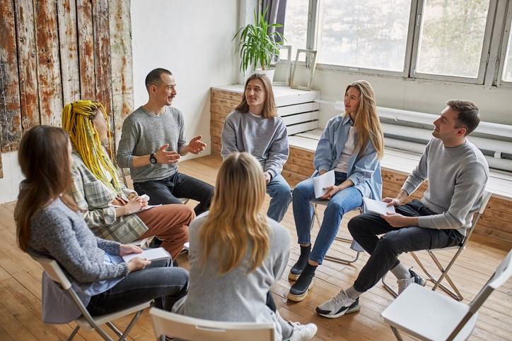 people sitting in a circle talking