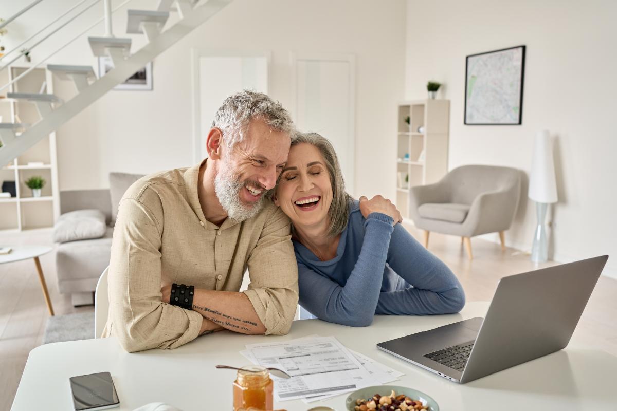 Couple looking at finances on a laptop