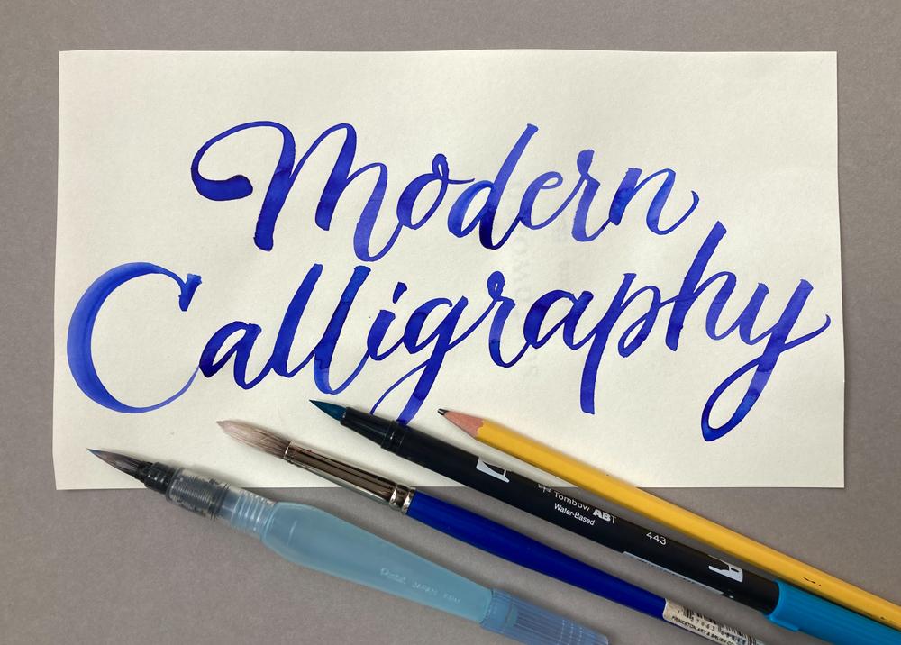 modern calligraphy in blue text